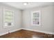 Bedroom with hardwood floors, natural light and ceiling fan with light at 130 Casper Rd, Gold Hill, NC 28071