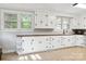 Charming kitchen featuring white cabinets, wood countertops, and bright windows with natural light at 130 Casper Rd, Gold Hill, NC 28071
