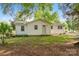 Exterior view of home featuring white siding, a well-maintained lawn, and a tree-lined landscape at 130 Casper Rd, Gold Hill, NC 28071
