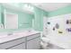 Bright bathroom featuring double sinks, quartz countertop, and a shower with a bathtub at 133 W Neel Ranch Rd, Mooresville, NC 28115