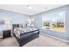 Cozy bedroom with a large window providing natural light and a comfortable bed at 133 W Neel Ranch Rd, Mooresville, NC 28115