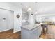 Open concept kitchen with an island, stainless steel appliances, and an open view of the living and dining areas at 133 W Neel Ranch Rd, Mooresville, NC 28115