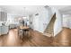 Spacious open floor plan seamlessly connects the kitchen, dining area, and stairway at 133 W Neel Ranch Rd, Mooresville, NC 28115