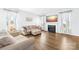 Inviting living room features hardwood floors, a fireplace, and light-filled windows at 133 W Neel Ranch Rd, Mooresville, NC 28115