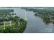Expansive aerial of waterfront neighborhood with private docks and lush greenery at 134 Lawrence Tee Ln, Mooresville, NC 28117