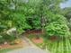 Aerial view of home on a well-manicured, wooded lot at 134 Lawrence Tee Ln, Mooresville, NC 28117