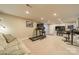 Finished basement with treadmill, lounge area, and desk setup, perfect for recreation and work at 134 Lawrence Tee Ln, Mooresville, NC 28117