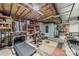 Unfinished basement featuring organized storage, exercise equipment, and ample space for various activities at 134 Lawrence Tee Ln, Mooresville, NC 28117