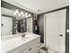 Remodeled bathroom with white vanity, modern fixtures, contemporary design, and striking wall accents at 134 Lawrence Tee Ln, Mooresville, NC 28117