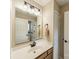 Bathroom featuring a well-lit vanity, an elongated mirror, and black and white patterned flooring at 134 Lawrence Tee Ln, Mooresville, NC 28117
