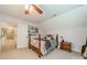 Cozy bedroom with soft carpet, ceiling fan, and a view to the hallway at 134 Lawrence Tee Ln, Mooresville, NC 28117