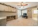 Spacious bedroom includes built-in cabinets and desk area, ceiling fan, and large window with shutters at 134 Lawrence Tee Ln, Mooresville, NC 28117