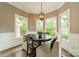Bright breakfast nook with a round table, banquette seating, and large windows offering a view at 134 Lawrence Tee Ln, Mooresville, NC 28117
