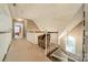 Open hallway featuring a staircase, chair, and a view of the bedroom at 134 Lawrence Tee Ln, Mooresville, NC 28117