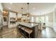 Gourmet kitchen with granite countertops, a large island, and modern stainless steel appliances at 134 Lawrence Tee Ln, Mooresville, NC 28117