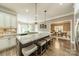 Gourmet kitchen with granite countertops, island seating, and open to the dining room at 134 Lawrence Tee Ln, Mooresville, NC 28117