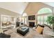 Bright living room with fireplace, cathedral ceiling, and large windows at 134 Lawrence Tee Ln, Mooresville, NC 28117