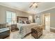 Comfortable main bedroom with hardwood floors, a cozy rug, and decorative furnishings at 134 Lawrence Tee Ln, Mooresville, NC 28117