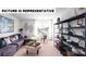 A spacious living room with modern decor, a large sectional sofa, desk, and stylish shelving at 135 Way Cross Ln, Troutman, NC 28166