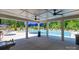 Relaxing community pool with lounge chairs and covered seating area at 143 Way Cross Ln, Troutman, NC 28166