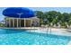 Inviting community pool with splash fountain, lounge chairs and umbrellas at 143 Way Cross Ln, Troutman, NC 28166