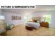 Relax in this stylish bedroom featuring a comfortable bed, natural light, and tastefully selected decor at 143 Way Cross Ln, Troutman, NC 28166