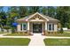 Charming pool house with gated entry, well-maintained landscaping, and lawn at 143 Way Cross Ln, Troutman, NC 28166