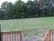 Expansive backyard view from wooden porch with mature trees surrounding the property at 144 Mason Tanner Ct, Rock Hill, SC 29730