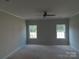 Bright bedroom with ample light from the large windows and a ceiling fan at 144 Mason Tanner Ct, Rock Hill, SC 29730