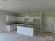 Bright kitchen with white cabinets, granite countertops and a center island with sink at 144 Mason Tanner Ct, Rock Hill, SC 29730