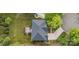 Birds-eye view of a home with a well-maintained roof, a pergola, and a spacious backyard with mature trees at 15406 Pepperwood Ct, Huntersville, NC 28078