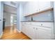 Convenient butler's pantry with stylish backsplash, granite counters, and ample storage at 15406 Pepperwood Ct, Huntersville, NC 28078