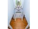 Aerial view of foyer featuring hardwood floors, white pillars and chandelier at 15406 Pepperwood Ct, Huntersville, NC 28078
