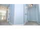 Bright hallway with neutral carpet and light blue walls leads to upstairs bedrooms and living areas at 15406 Pepperwood Ct, Huntersville, NC 28078