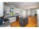 Modern kitchen with granite countertops, stainless steel appliances, and hardwood flooring at 15406 Pepperwood Ct, Huntersville, NC 28078