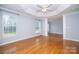 Spacious main bedroom features hardwood floors, tray ceilings, and large windows for natural light at 15406 Pepperwood Ct, Huntersville, NC 28078
