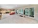 Basement with a pool table, sitting area, and access to the backyard through glass doors and windows at 160 Fernbrook Dr, Mooresville, NC 28117
