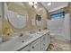 Bathroom featuring double sinks, granite countertops, and a tub-shower combo at 160 Fernbrook Dr, Mooresville, NC 28117