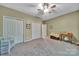 Large bedroom with carpet, ample closet space, neutral walls, and a ceiling fan at 160 Fernbrook Dr, Mooresville, NC 28117
