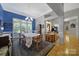 Elegant dining room with large windows, hardwood floors, and stylish décor, perfect for formal gatherings and Gathering dinners at 160 Fernbrook Dr, Mooresville, NC 28117
