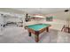 This game room features a classic pool table with overhead lighting and room for entertaining at 160 Fernbrook Dr, Mooresville, NC 28117