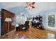 Bright home office with vaulted ceiling, hardwood floors, built-in shelving, and a large window at 160 Fernbrook Dr, Mooresville, NC 28117