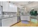 Bright kitchen featuring white cabinets, granite countertops, and stainless steel appliances at 160 Fernbrook Dr, Mooresville, NC 28117