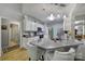 Modern kitchen with granite countertops, stainless steel appliances, and stylish island seating, designed for culinary enthusiasts at 160 Fernbrook Dr, Mooresville, NC 28117