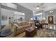 Cozy living room with hardwood floors, comfortable seating, and open access to the kitchen, perfect for entertaining at 160 Fernbrook Dr, Mooresville, NC 28117