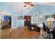Well-lit office with hardwood floors, built-in storage, and a comfortable workspace, ideal for productivity and focus at 160 Fernbrook Dr, Mooresville, NC 28117