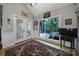 Bright sunroom with large windows offering serene backyard views, perfect for relaxing or entertaining guests at 160 Fernbrook Dr, Mooresville, NC 28117