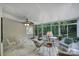 Inviting sunroom filled with natural light, perfect for relaxing and enjoying views of the surrounding nature at 160 Fernbrook Dr, Mooresville, NC 28117