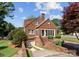 Charming brick home featuring a private driveway, and lush landscaping at 222 E Carter St, Lincolnton, NC 28092
