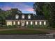 Charming brick home with black shutters, manicured landscaping, and a welcoming front entrance at 222 E Carter St, Lincolnton, NC 28092